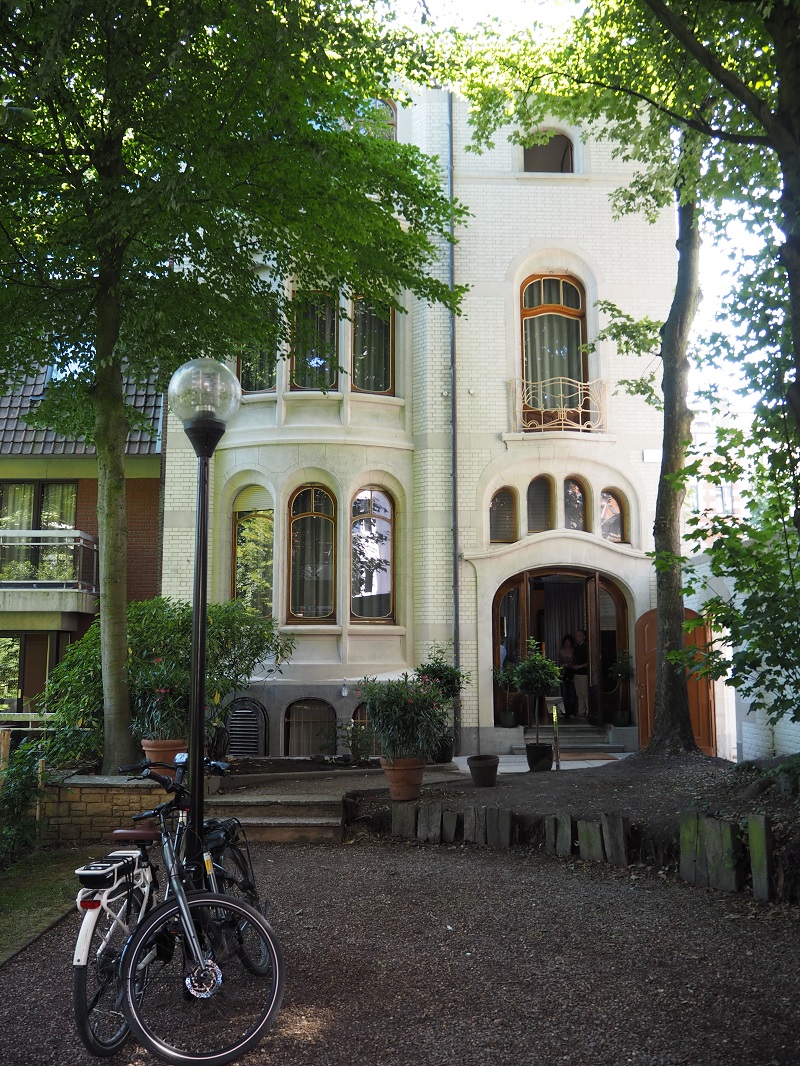 art nouveau house with a green yard in brussels
