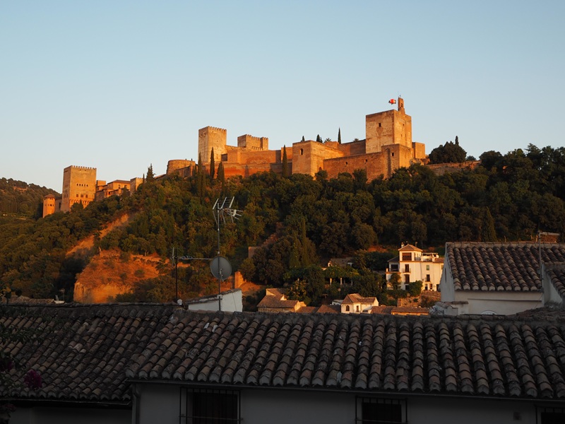 the alhambra glowing red in the evening light