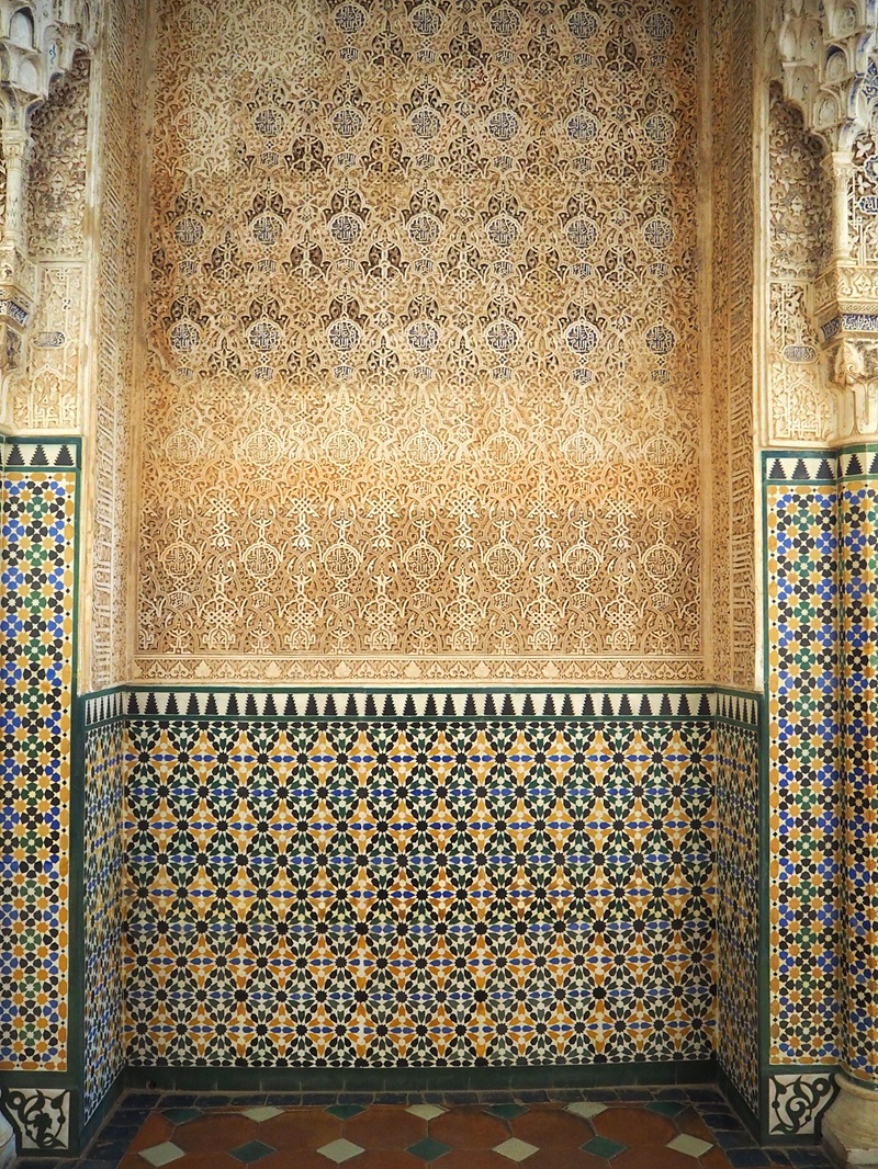 nasrid tiles and carvings at the alhambra granada